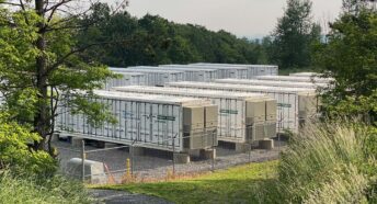 are battery energy storage system safe? image shows a dozen metal containers holding the batteries, behind a security fence