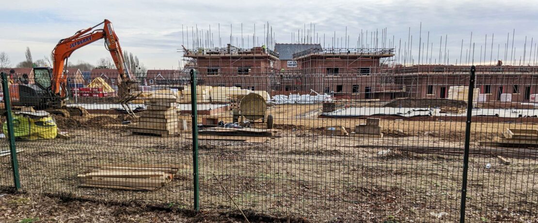 building site on on what had previously been lush green fields in the Green Belt