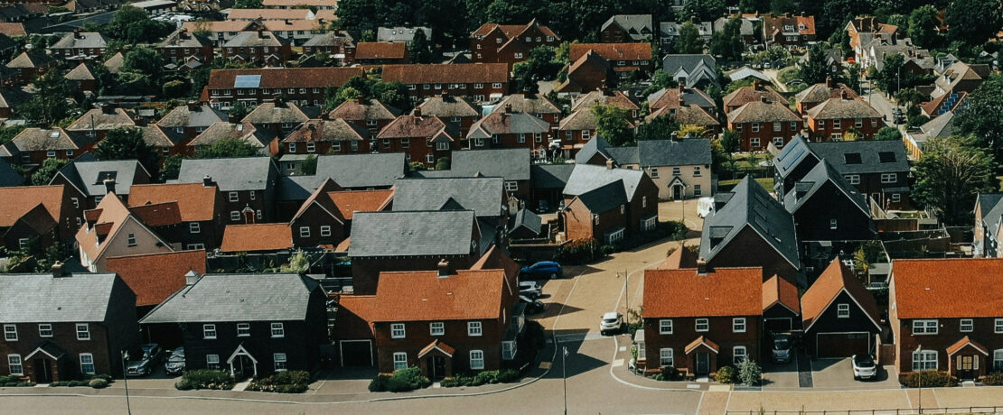 densely packed dwellings on what used to be open countryside